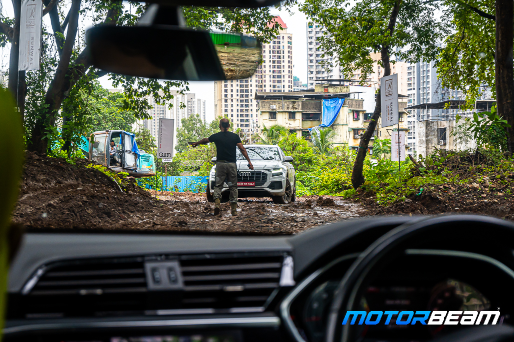 The Marshall guiding the Audi Q8 to climb the side-incline slope at the Audi Experience x Quattro Drive.